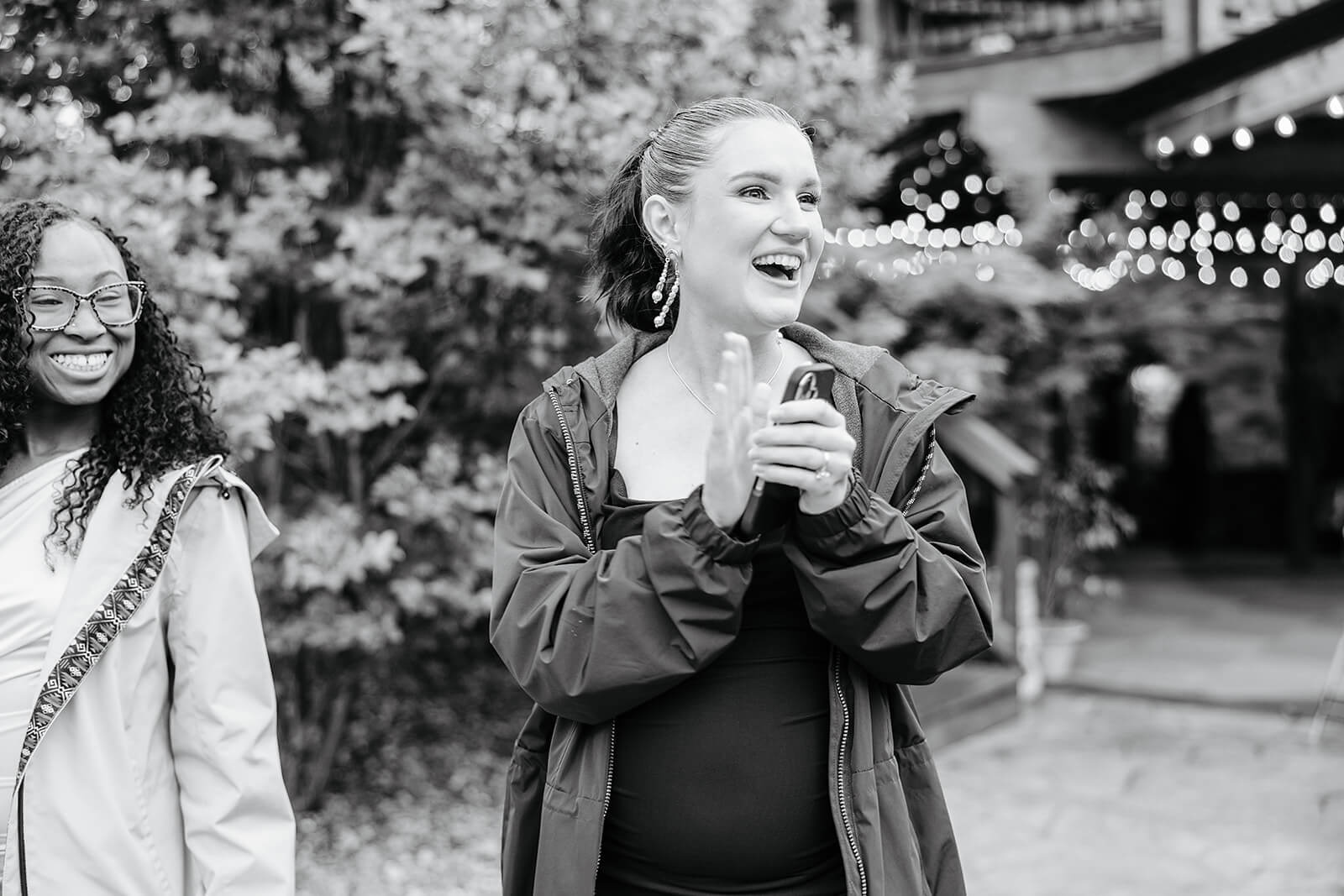 Vaughan Greenhouse Spring Wedding Photography 34 black and white photo of officiant clapping and laughing