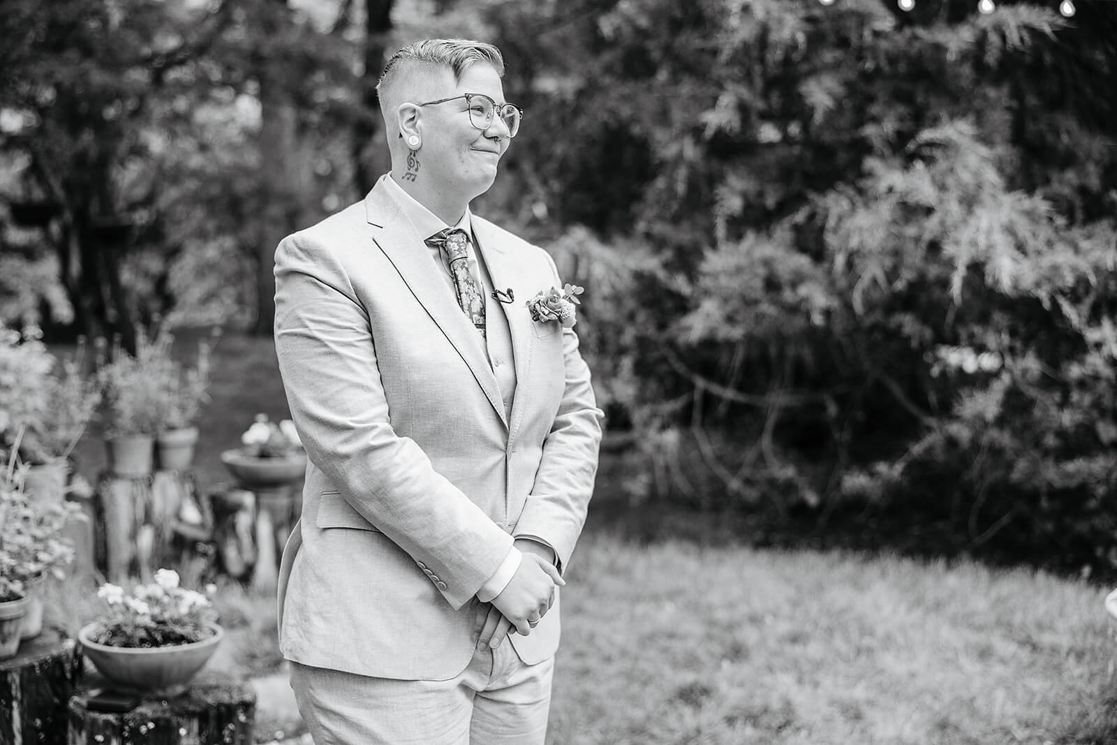 Vaughan Greenhouse Spring Wedding Photography 8 black and white photo of groom smiling and waiting at the alter