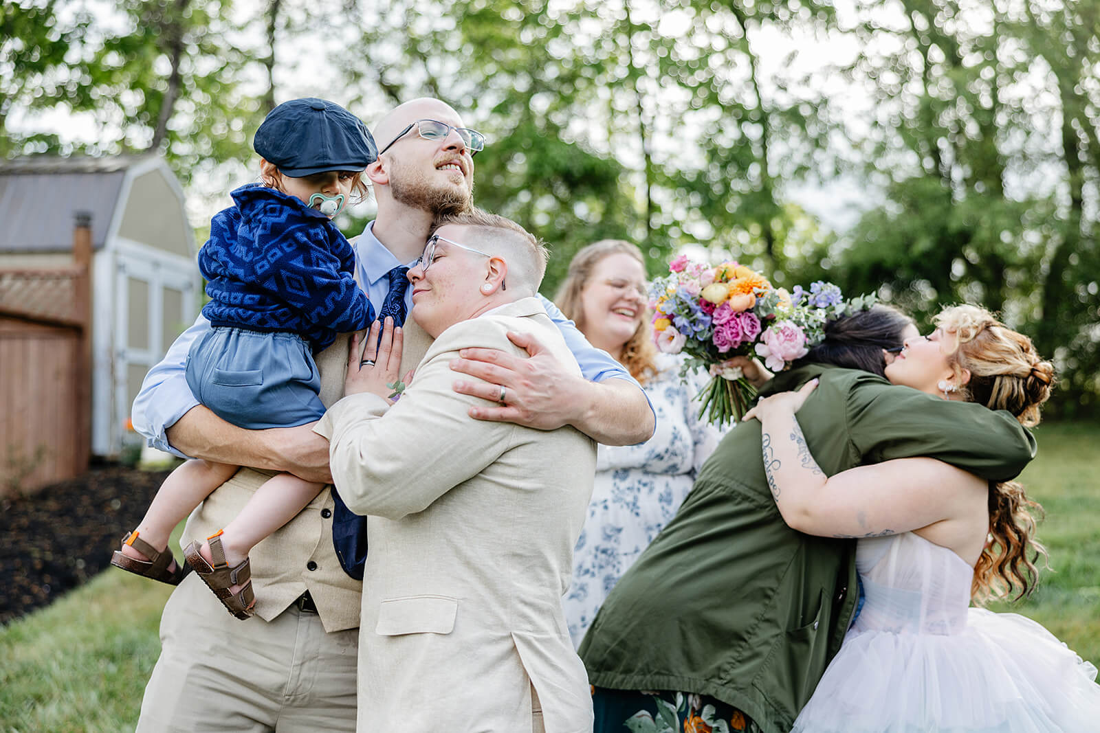 Vaughan Greenhouse Spring Wedding Photography 16 bride and groom outside, hugging their guests