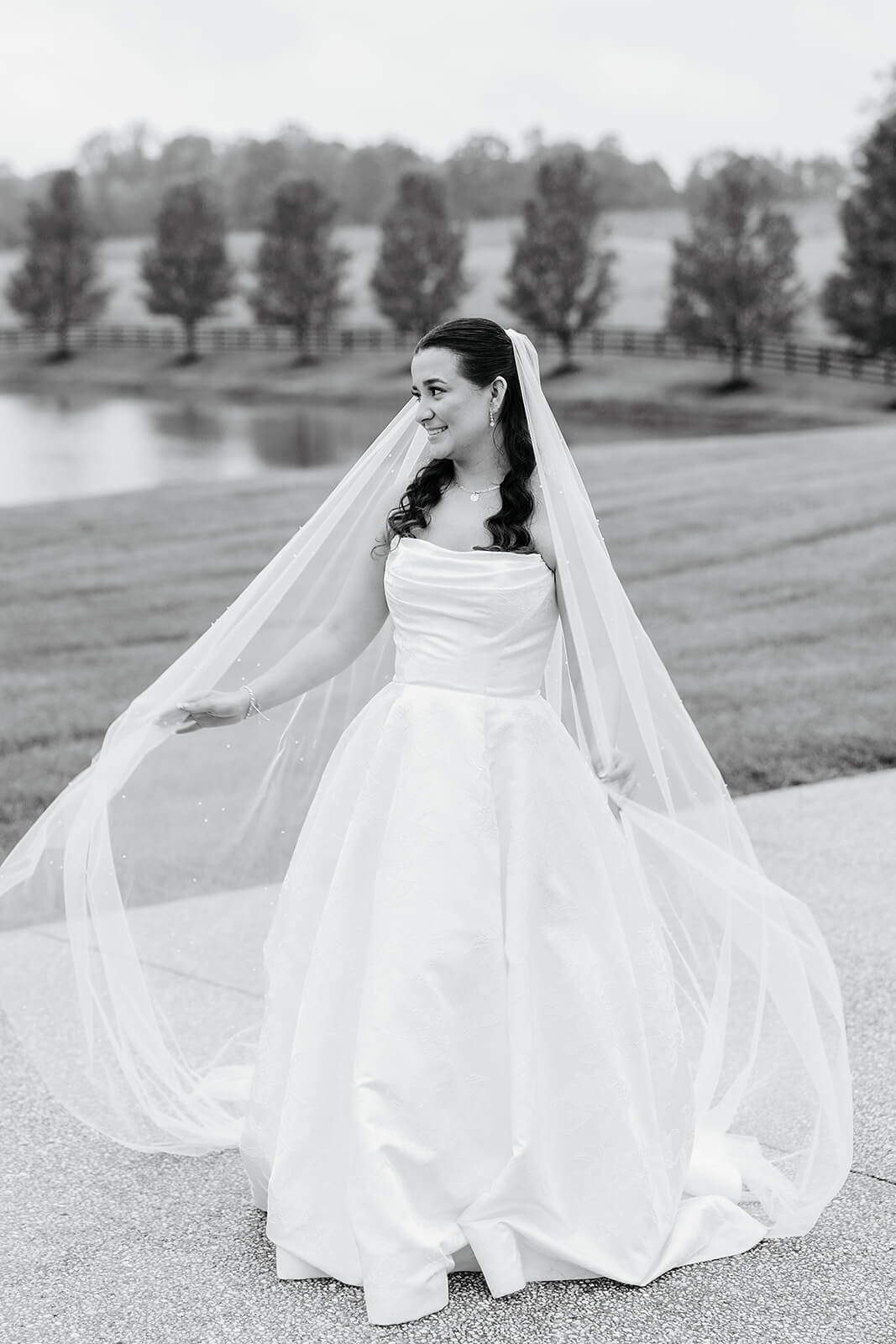 Matt + Adriana's May Wedding Photography 20 black and white portrait of bride swishing her veil around her outside