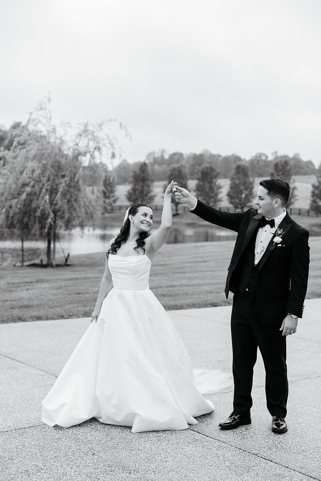 Matt + Adriana's May Wedding Photography 22 black and white photo of groom twirling bride outside