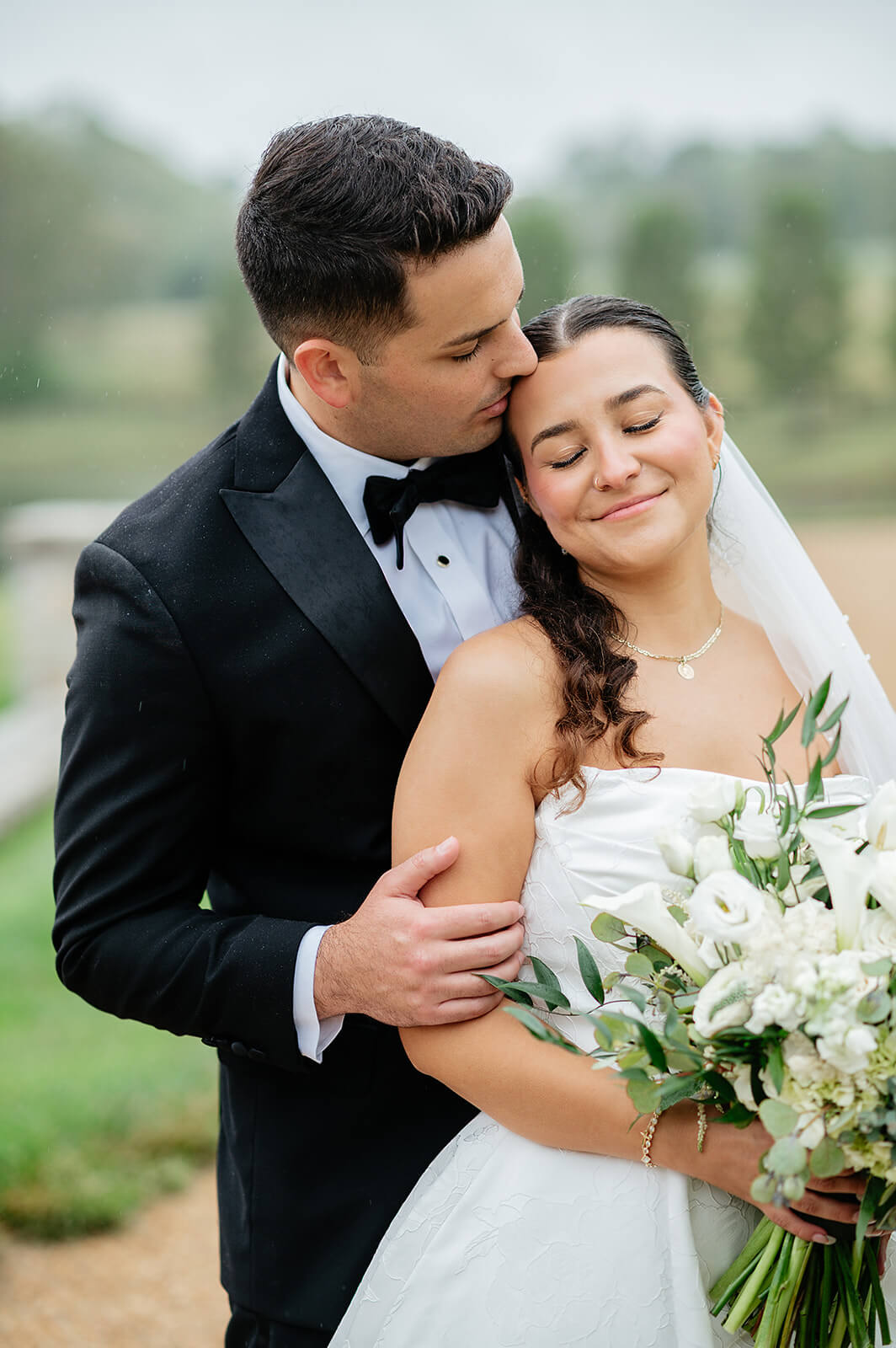 Matt + Adriana's May Wedding Photography 26 bride leaning against the groom and he's kissing her forehead