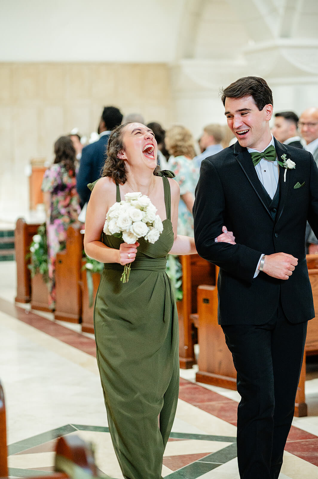 Matt + Adriana's May Wedding Photography 13 bridesmaid laughing while walking down the aisle with a groomsmen