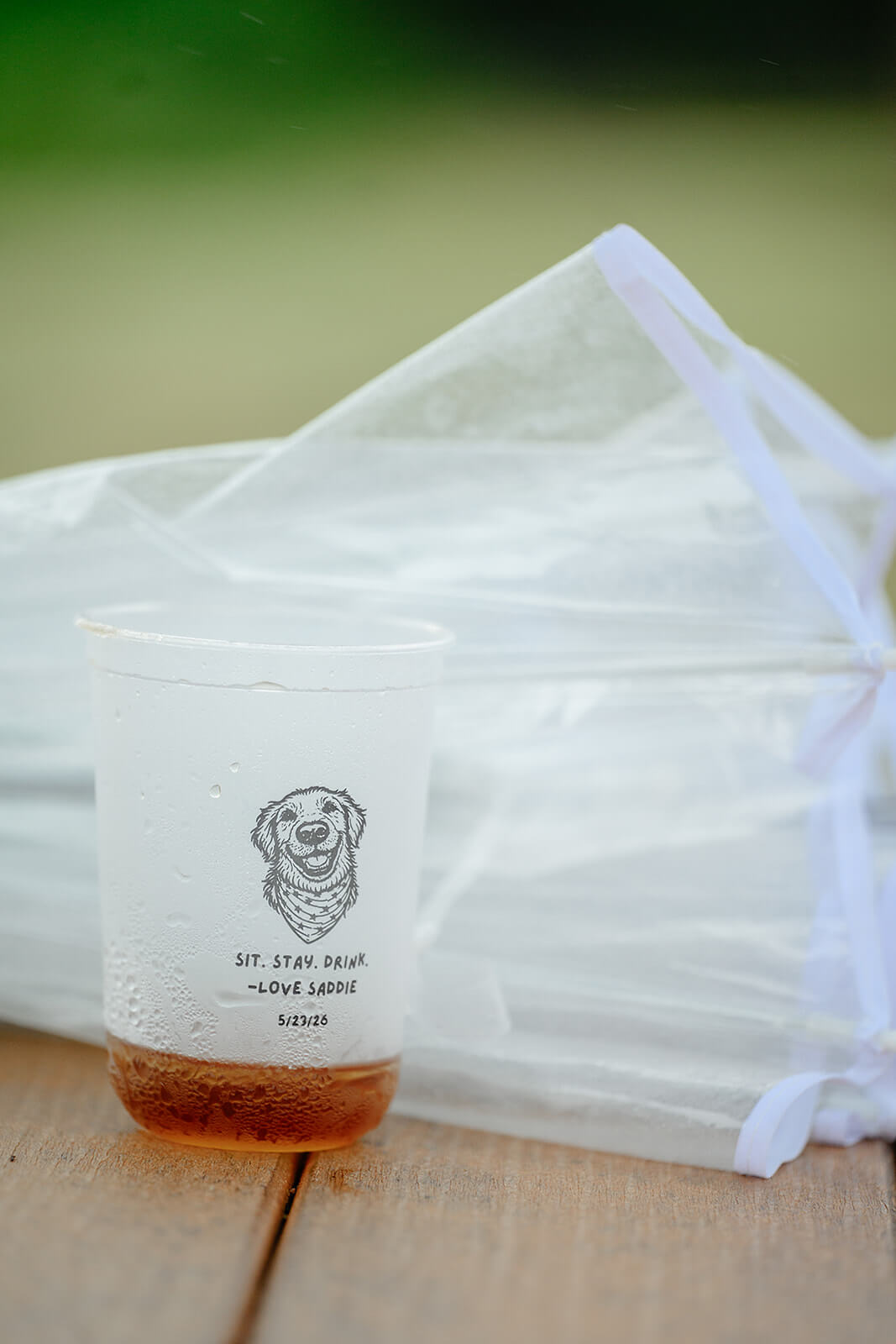 Family Farm Spring Wedding Photography 24 detail photo of umbrella and custom plastic cup with a dog on it