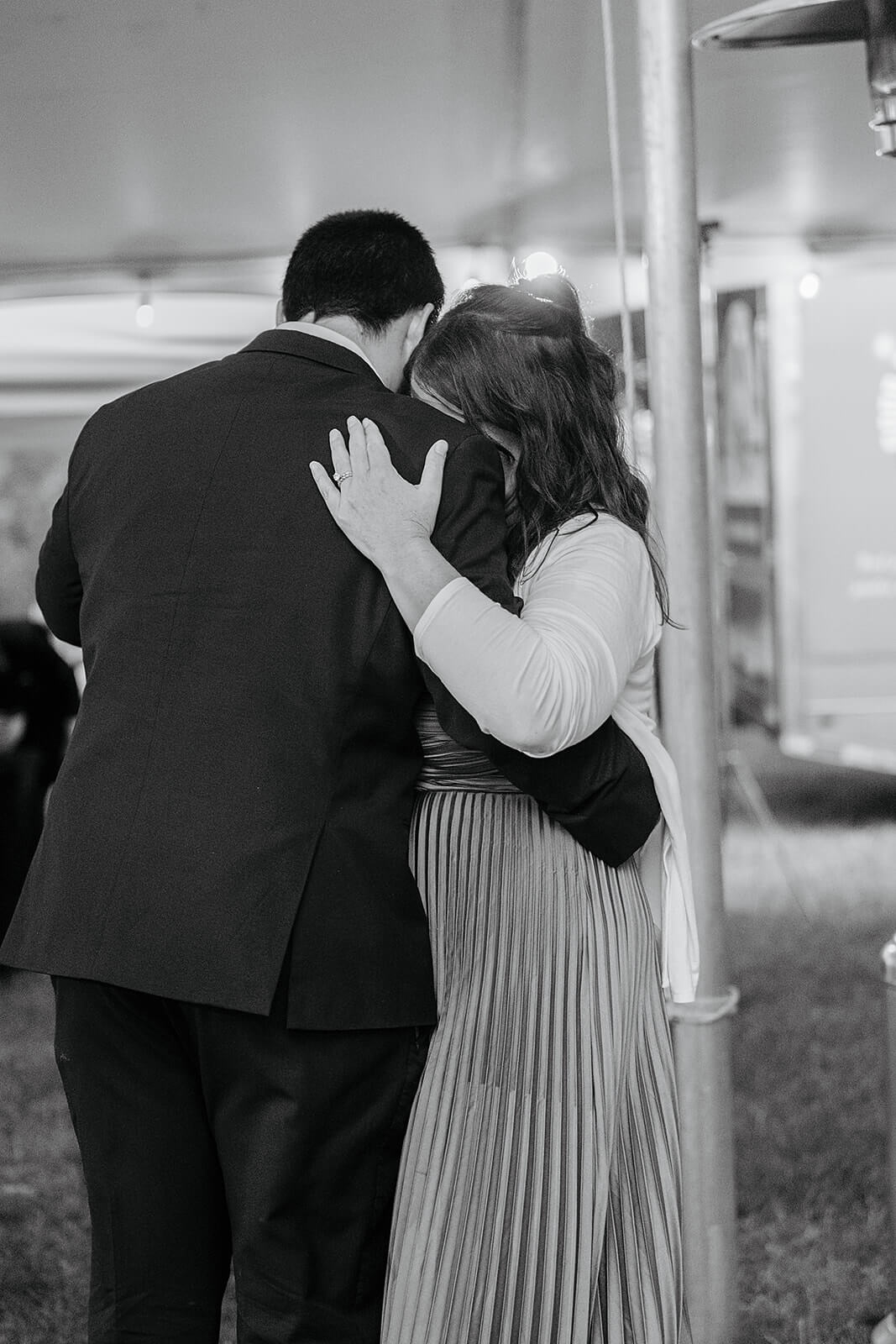 Family Farm Spring Wedding Photography 43 black and white photo of a guest couple sweetly dancing together
