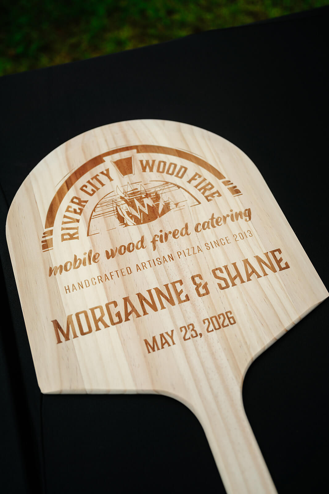 Family Farm Spring Wedding Photography 16 custom pizza paddle with couple's wedding date and pizza company name