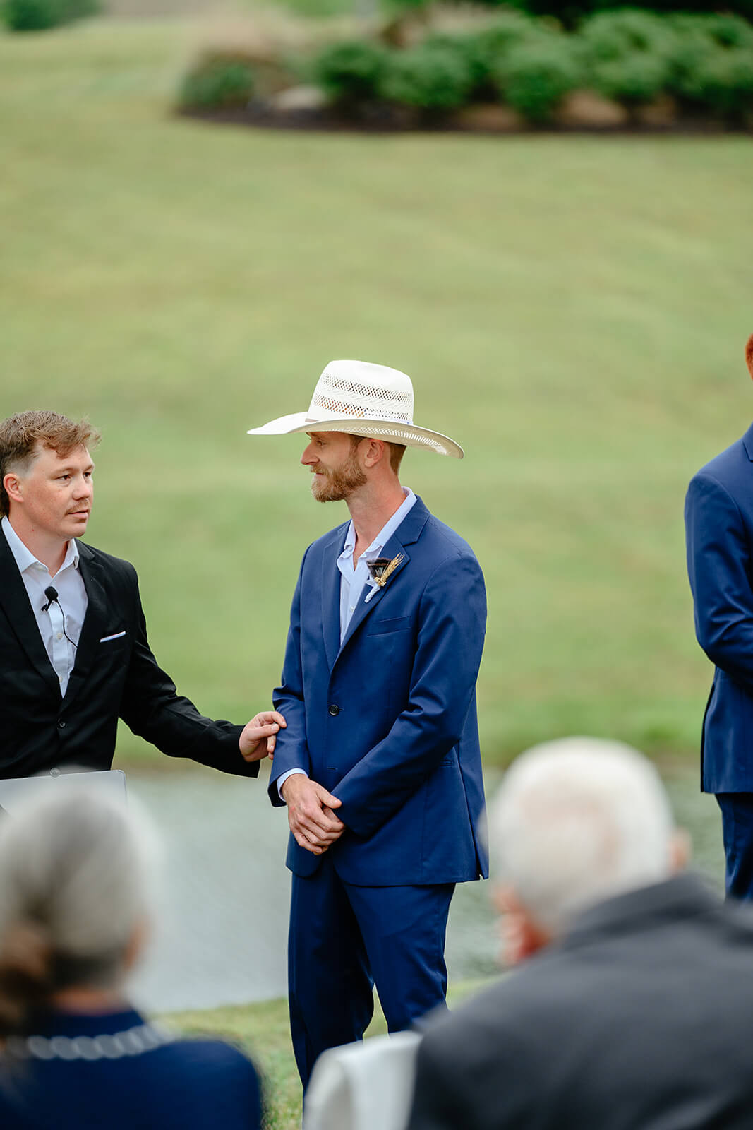 Family Farm Spring Wedding Photography 18 groom smiling and waiting for bride to walk down the aisle