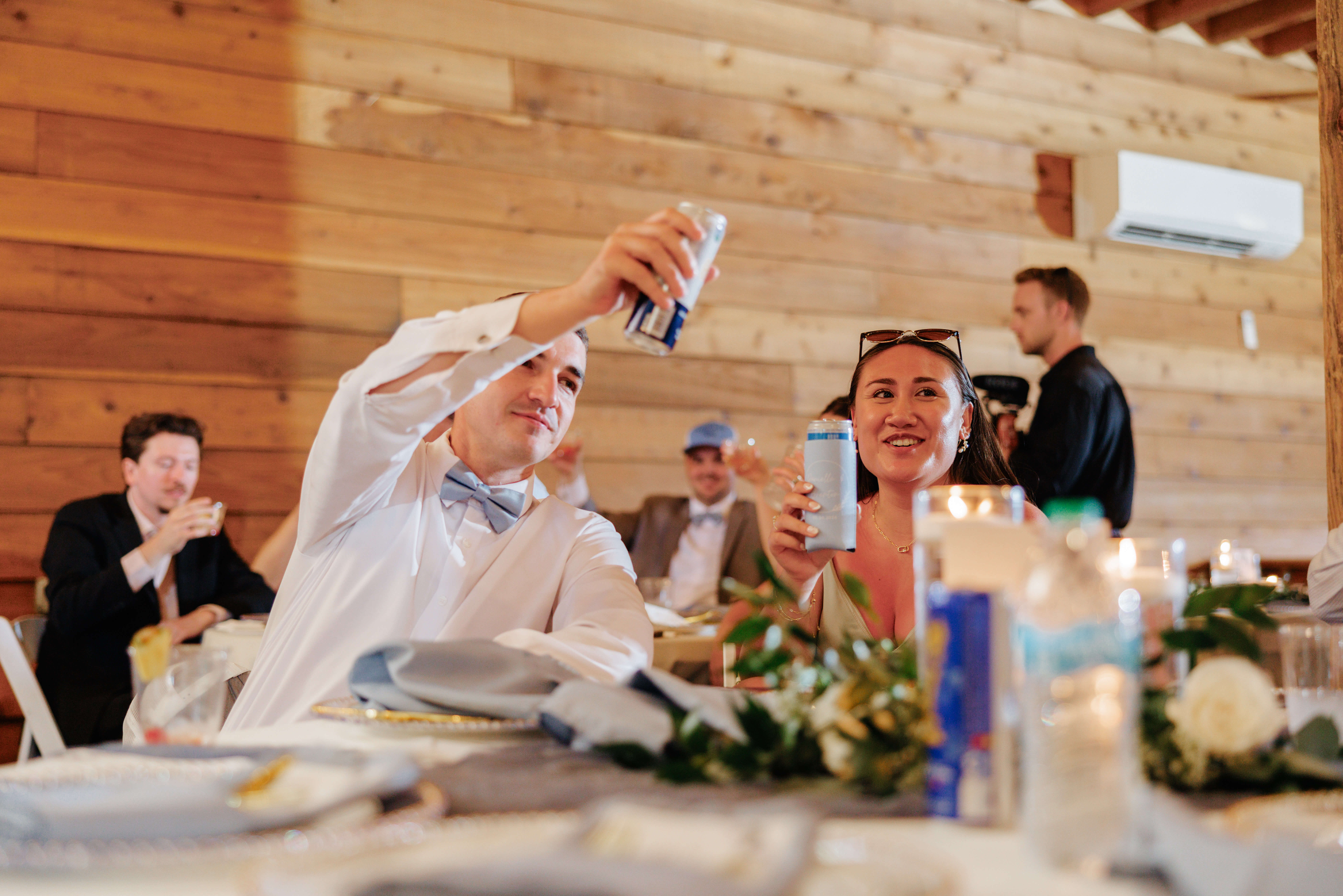 Malden Hill Spring Wedding Photography 26 guests lifting their drinks in the air for a toast