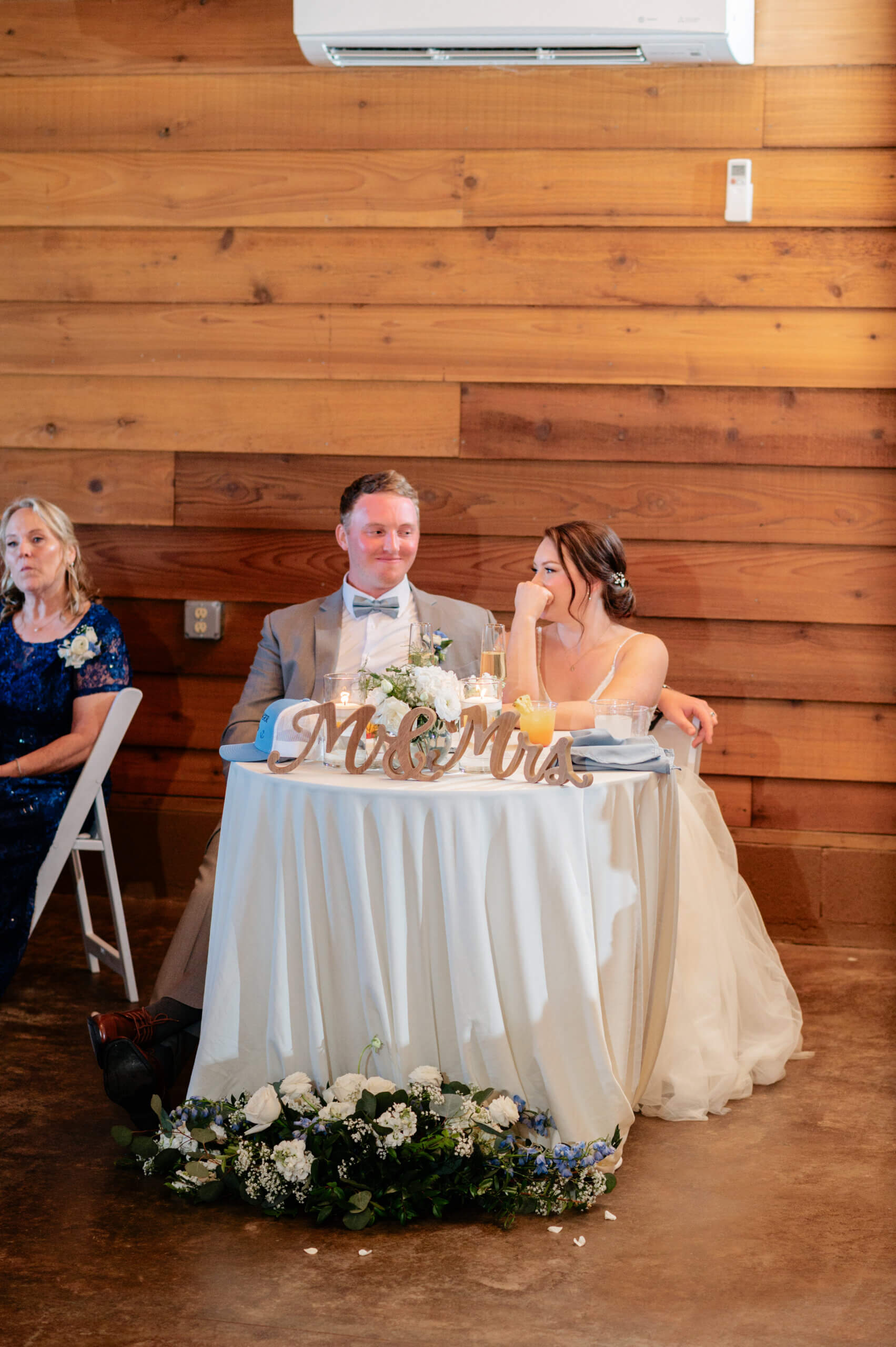 Malden Hill Spring Wedding Photography 27 bride and groom happily sitting together at the sweetheart table