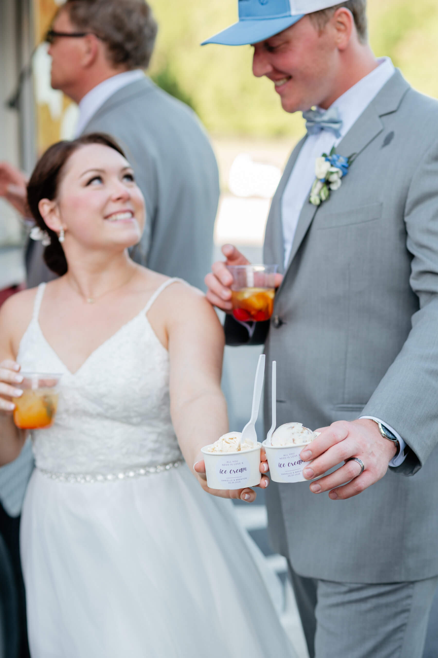 Malden Hill Spring Wedding Photography 33 bride and groom holding personalized ice cream cups