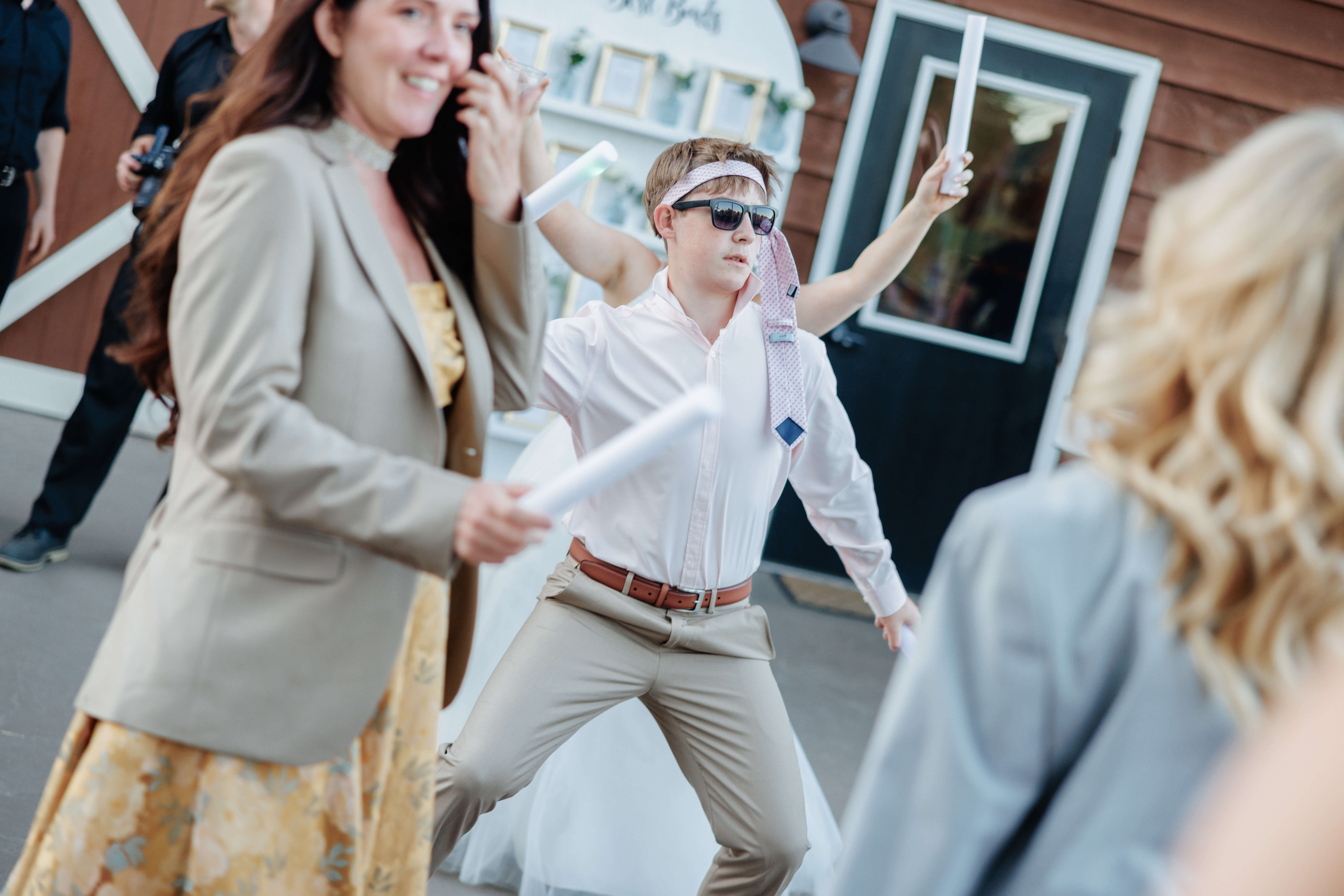 Malden Hill Spring Wedding Photography 41 guest with tie on his head dancing