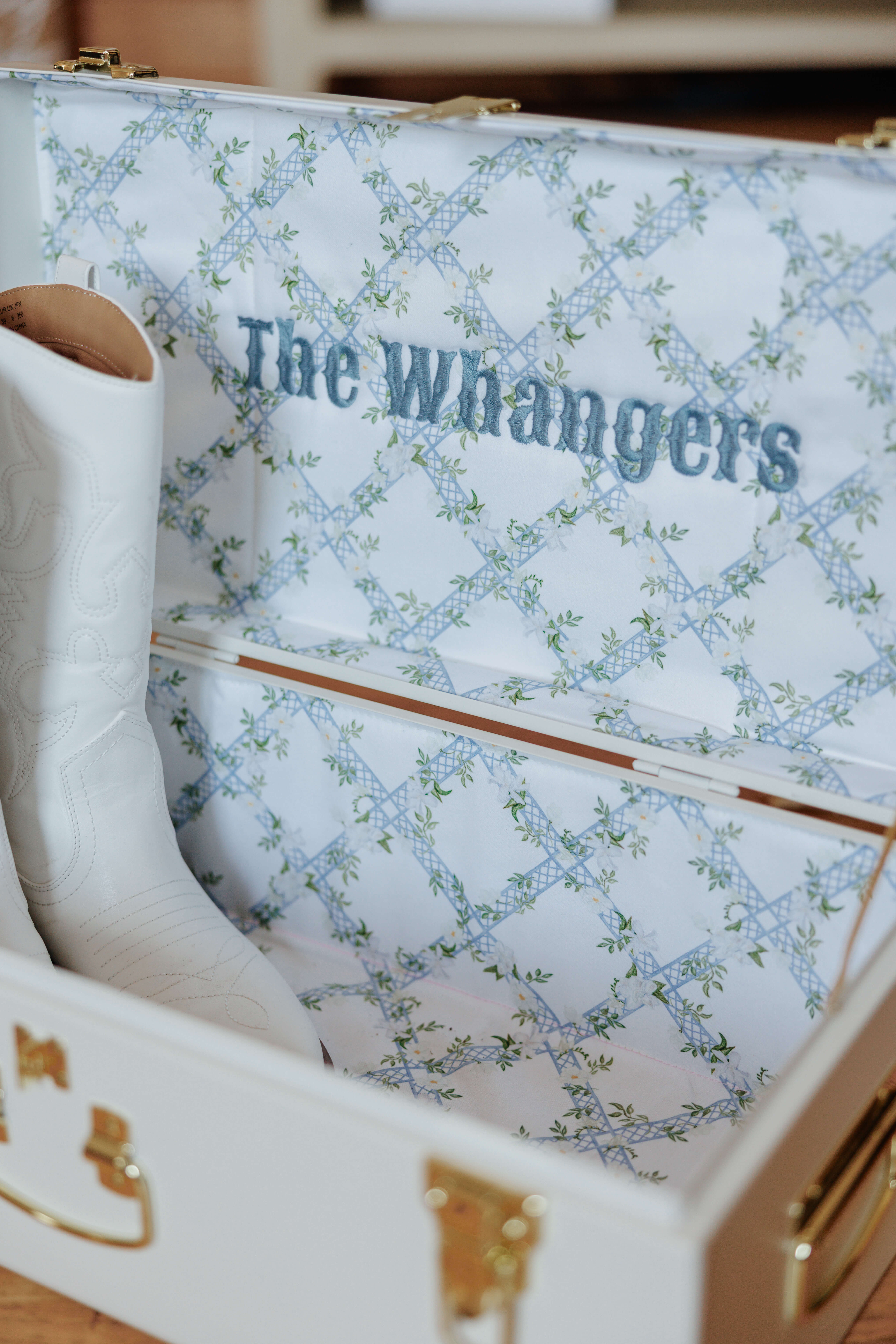 Malden Hill Spring Wedding Photography 3 detail shot of personalized shoe box with couple's last name and brides boots