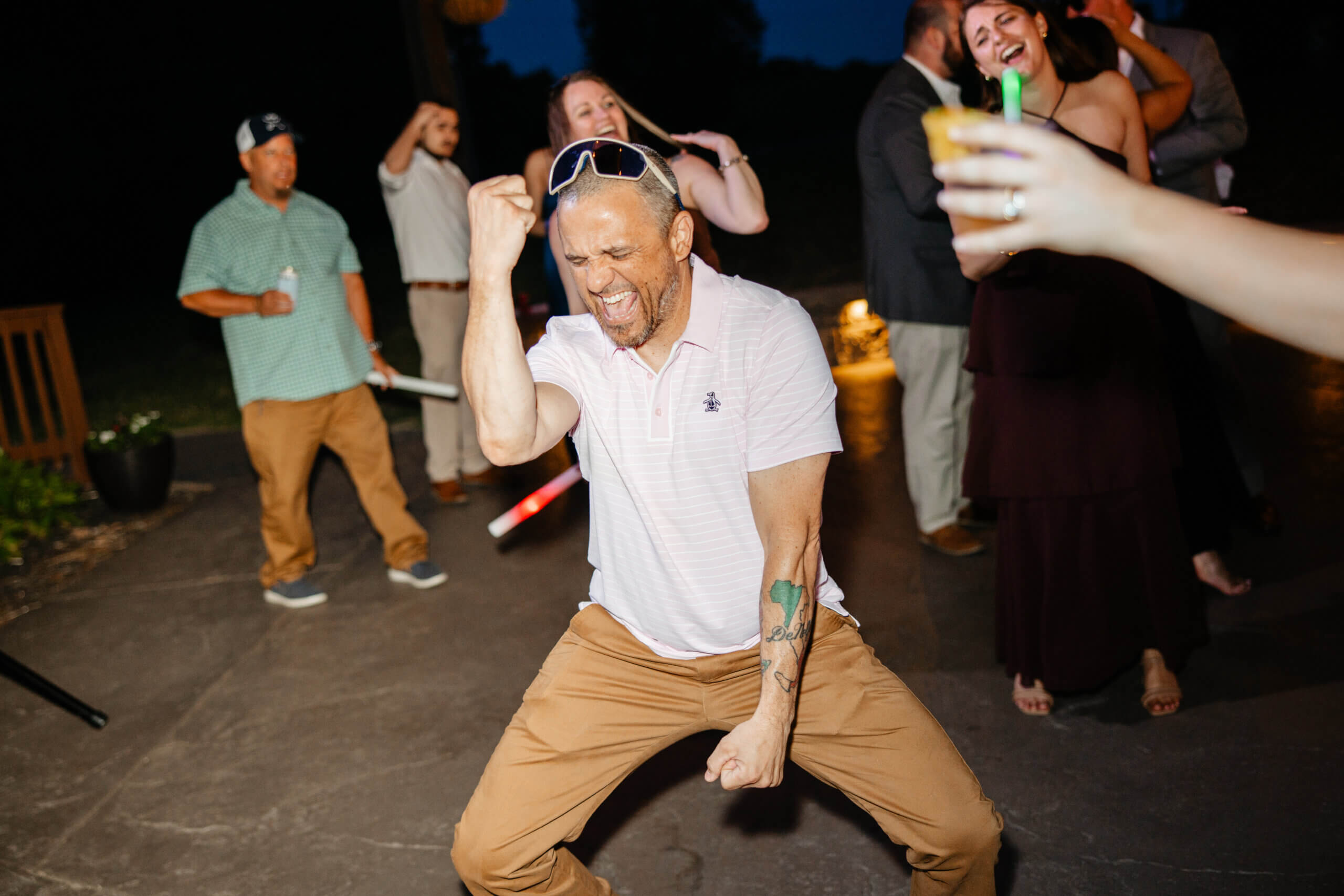 Malden Hill Spring Wedding Photography 43 guest dancing and smiling while other guests laugh and cheer