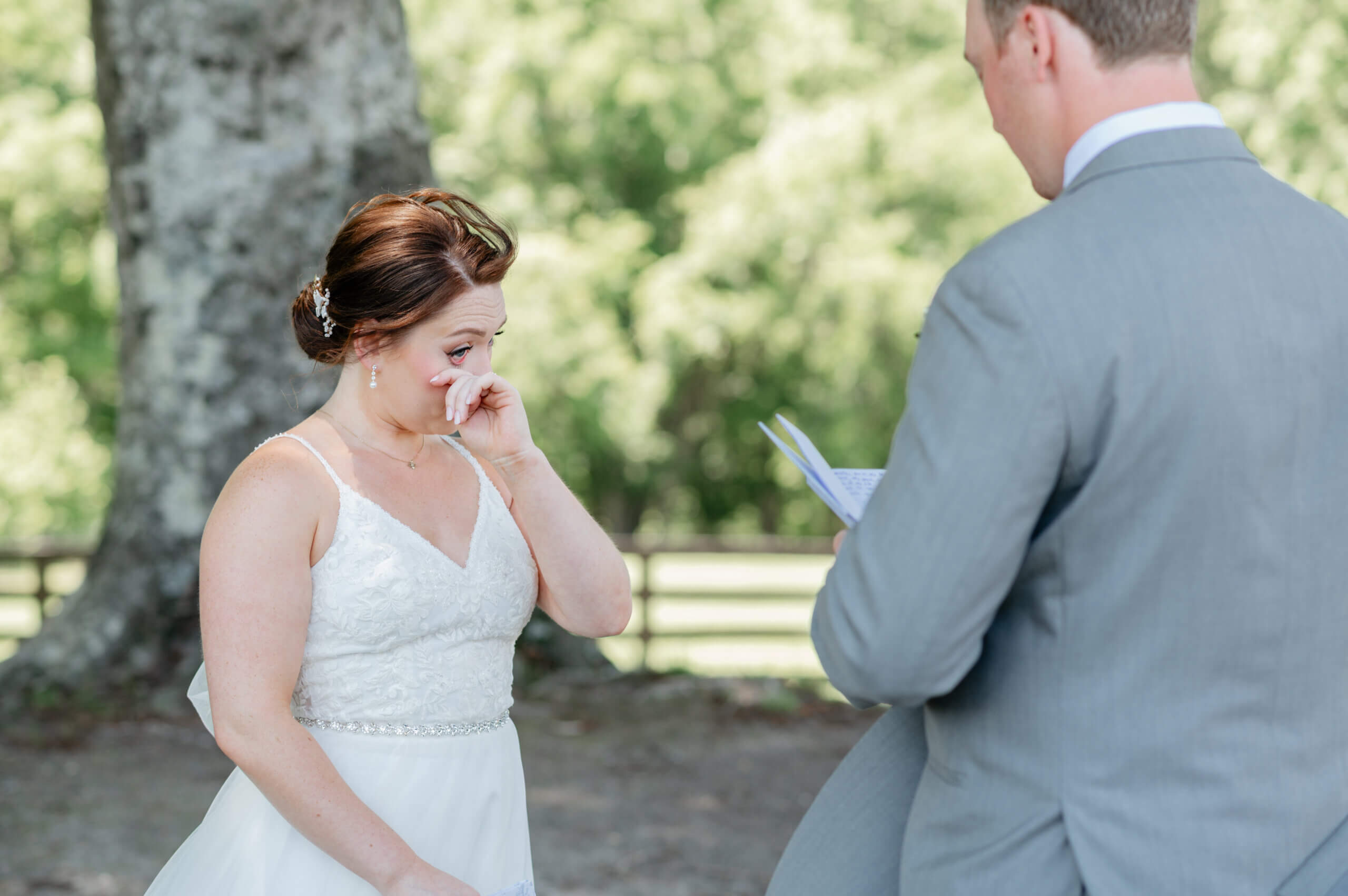 Malden Hill Spring Wedding Photography 7 bride wiping tears away as groom reads private vows