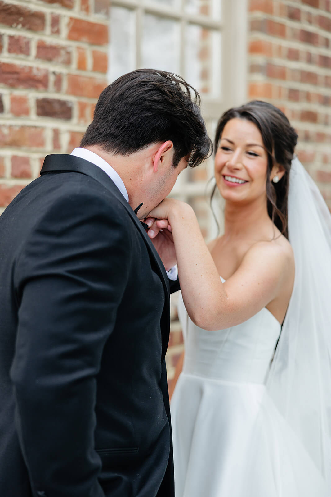 Estate at River Run Summer Wedding Photography 24 groom kissing bride's hand