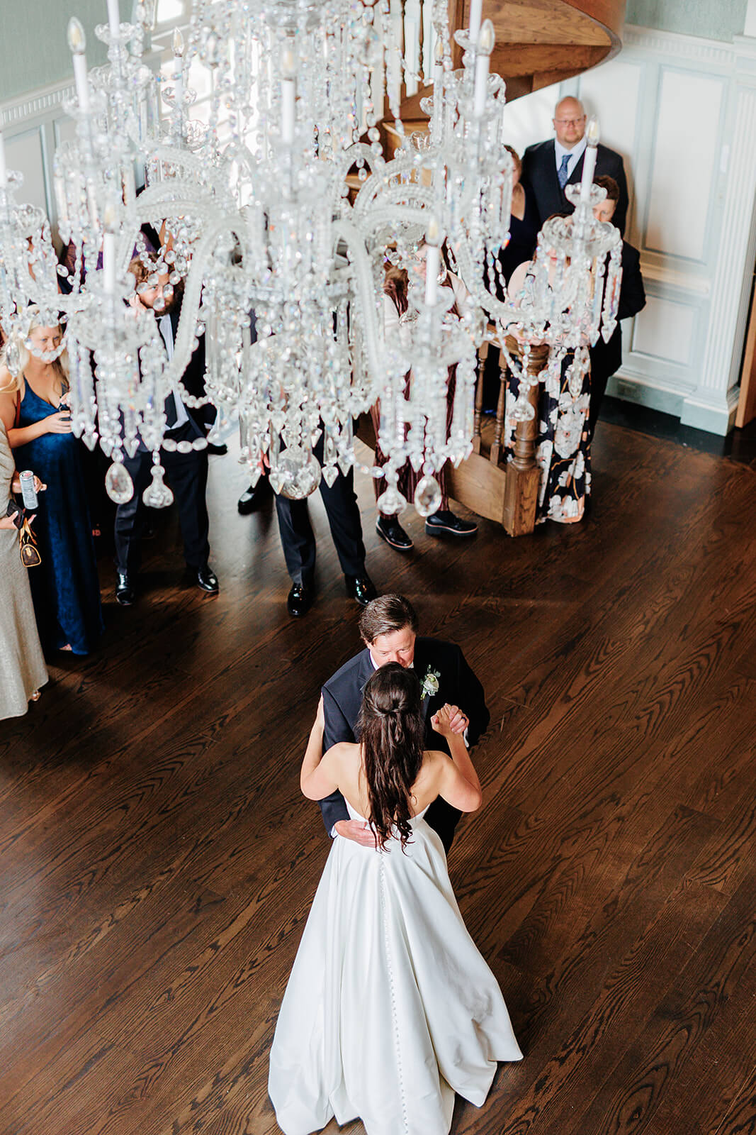 Estate at River Run Summer Wedding Photography 30 bride and father sharing a dance, there is a crystal chandelier above them