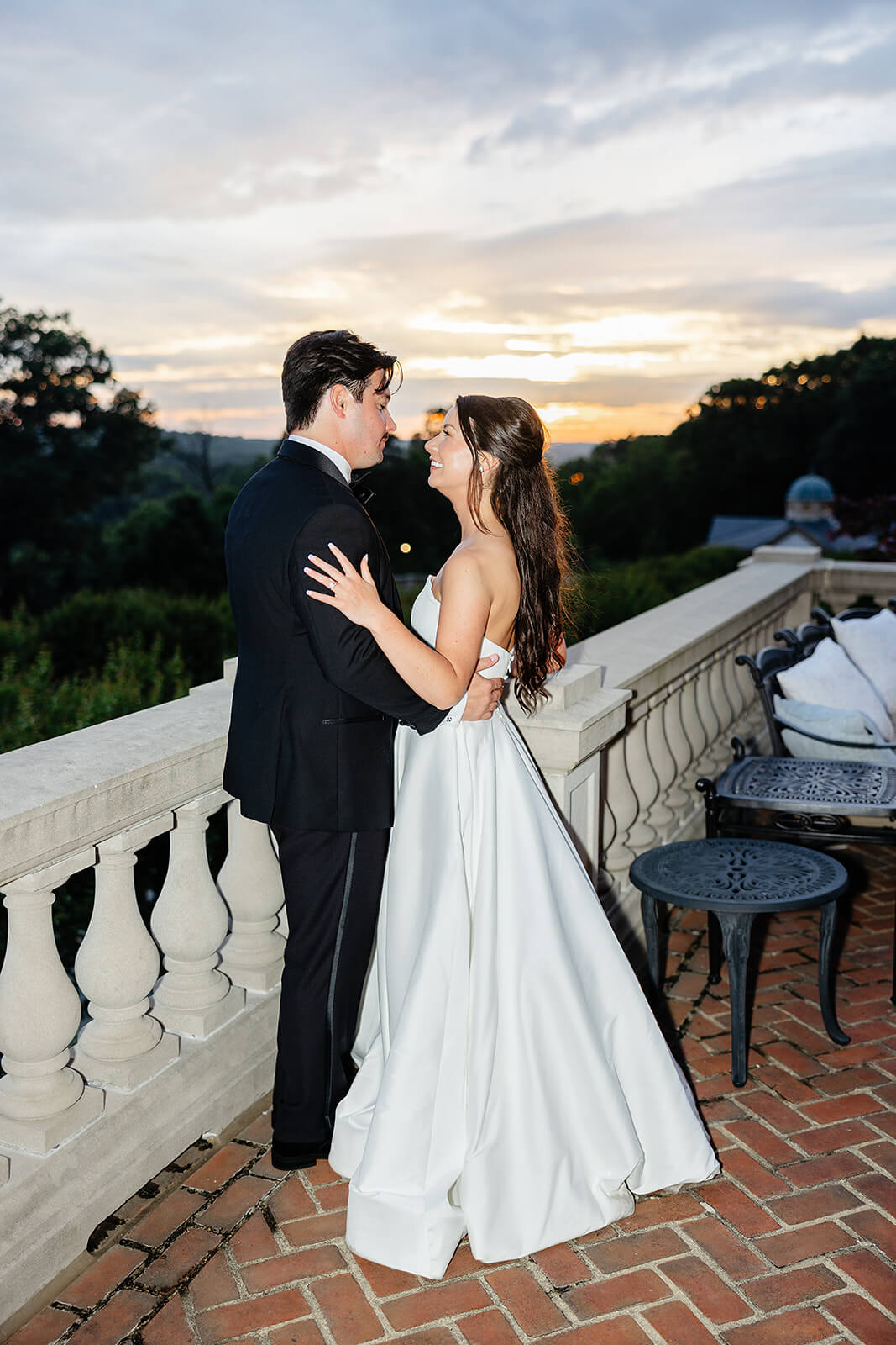 Estate at River Run Summer Wedding Photography 41 shadowy photo of bride and groom hugging each other with the sun setting