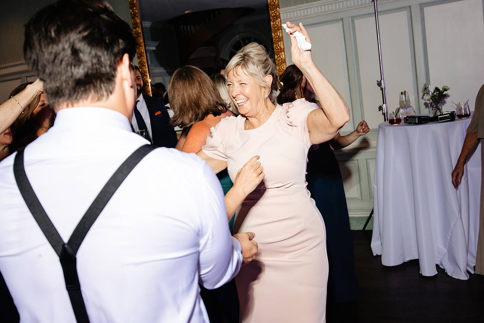 Estate at River Run Summer Wedding Photography 42 woman in pink dress dancing