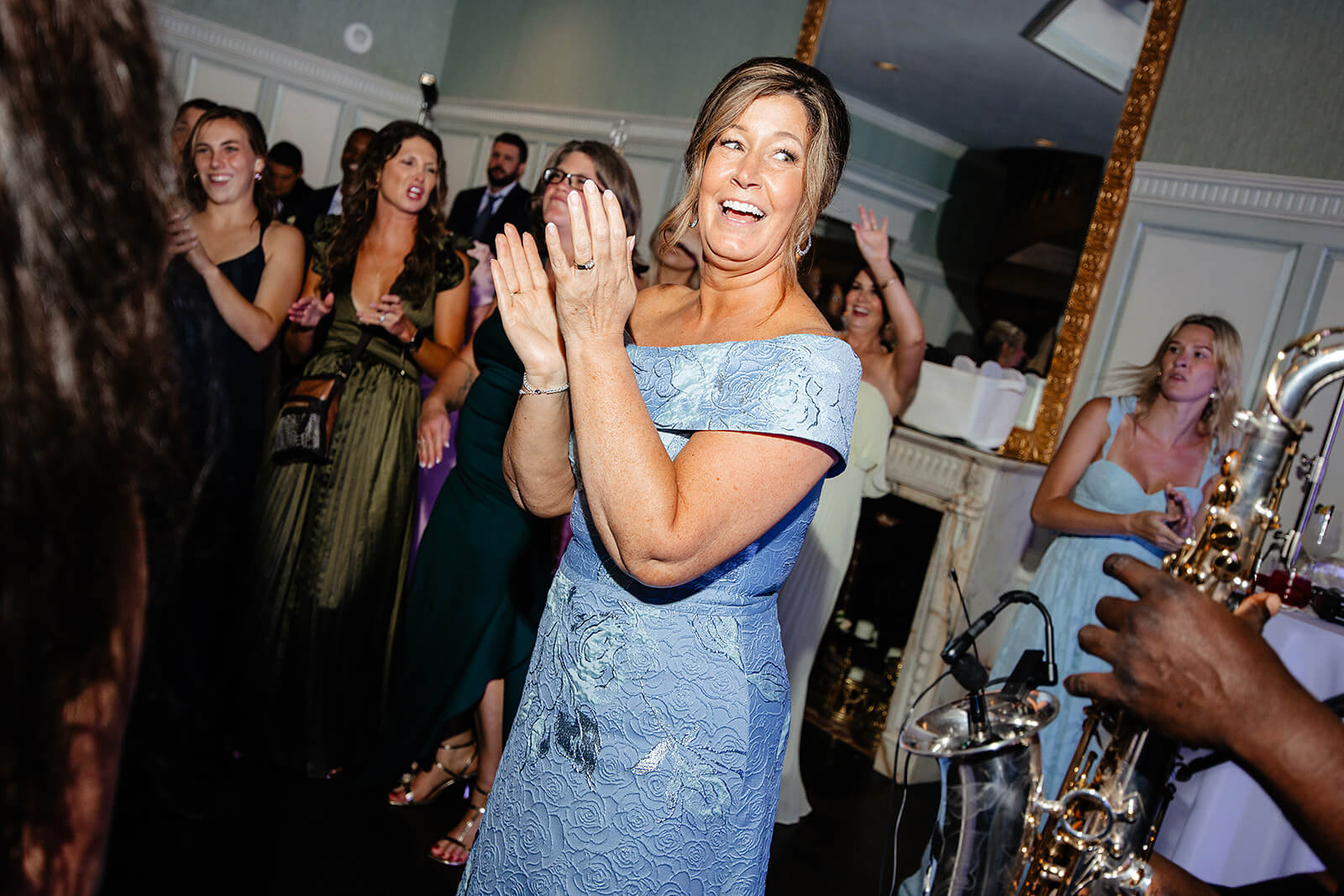 Estate at River Run Summer Wedding Photography 43 mother of the bride clapping and dancing on the dance floor