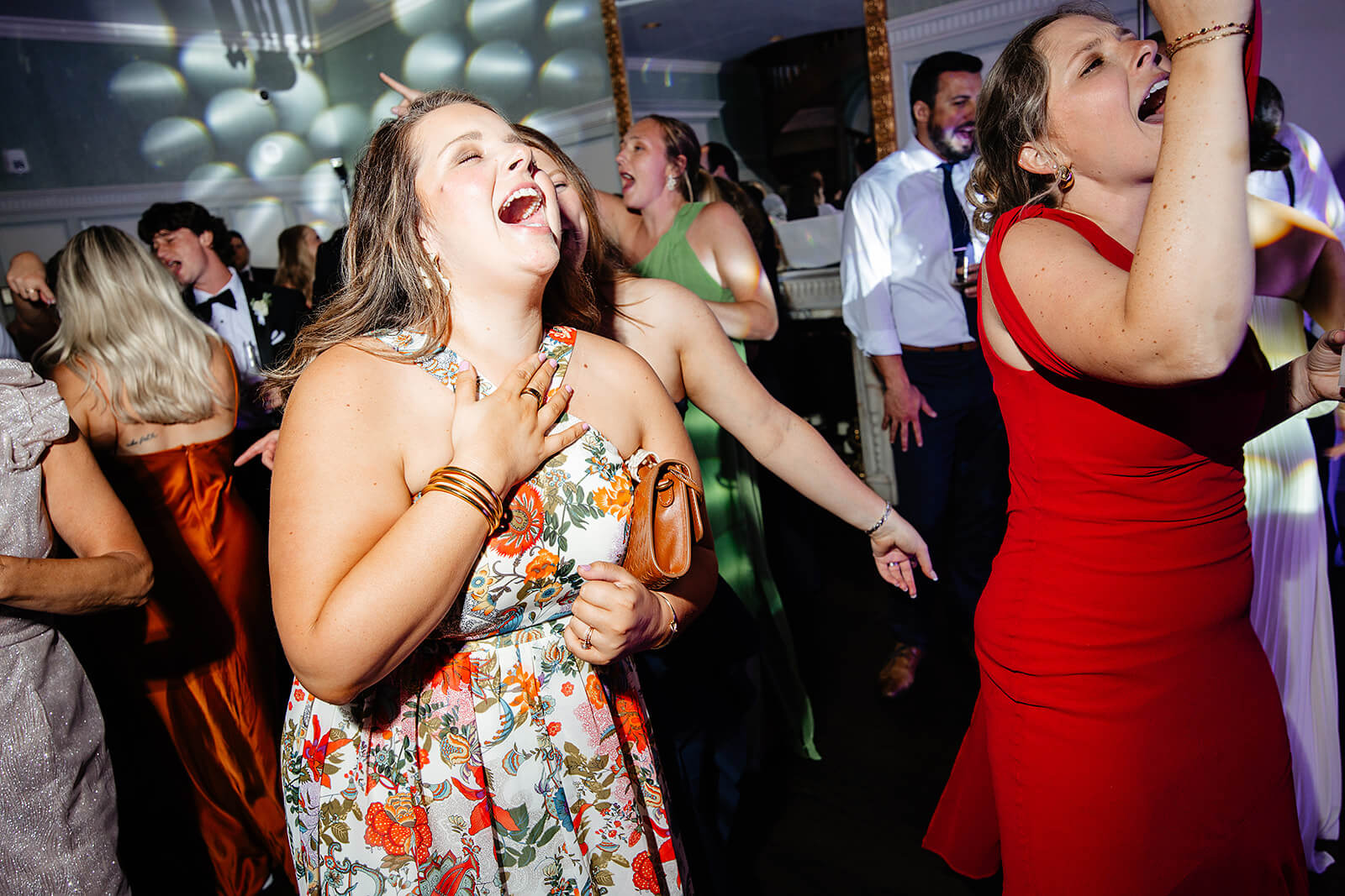 Estate at River Run Summer Wedding Photography 49 two women singing next to each other on the dance floor