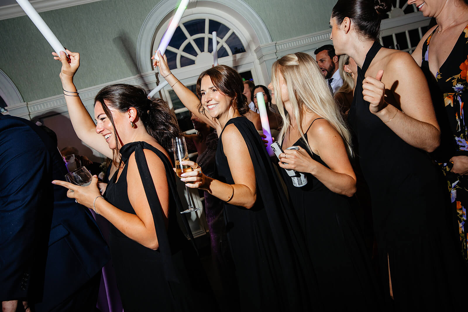 Estate at River Run Summer Wedding Photography 50 bridesmaids lined up dancing together on the dance floor