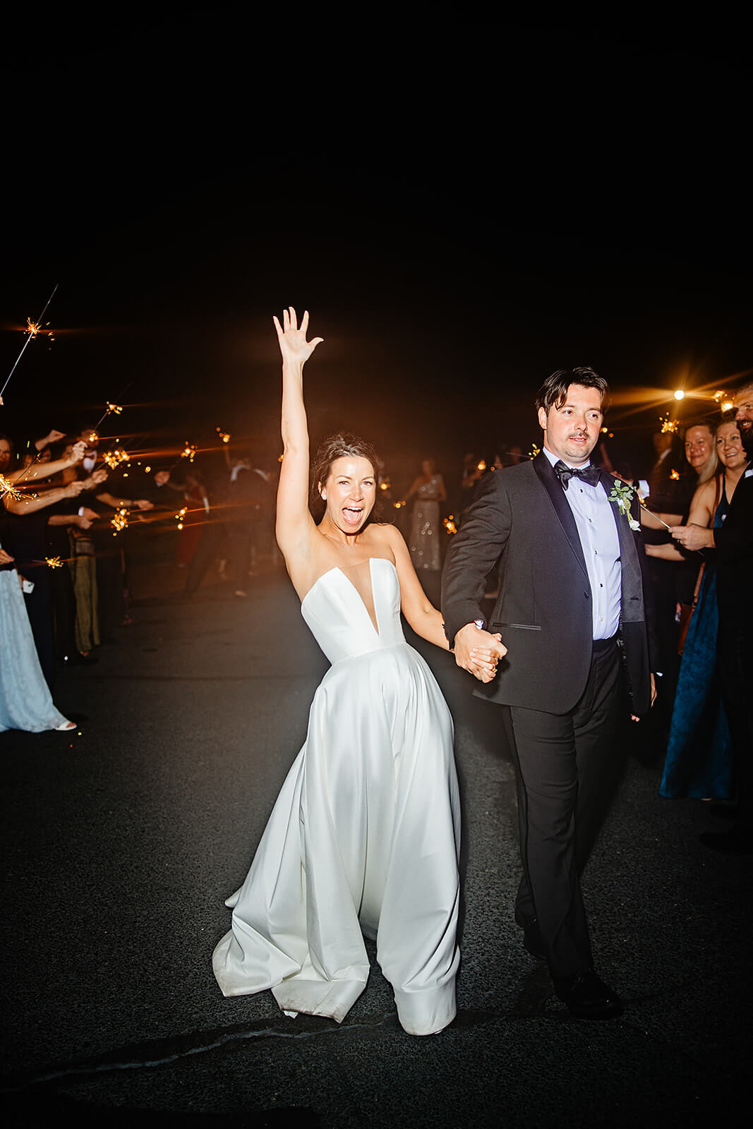 Estate at River Run Summer Wedding Photography 55 bride and groom cheering as they leave