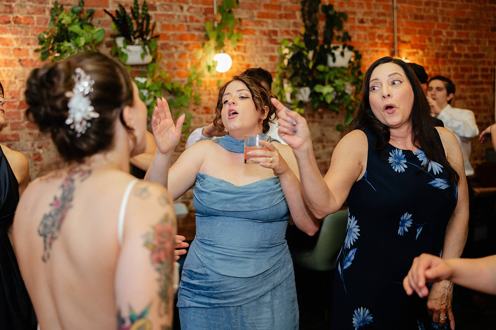 Laura Lee's Spring Wedding Photography 27 bride dancing with guests as they dance and hold their drinks