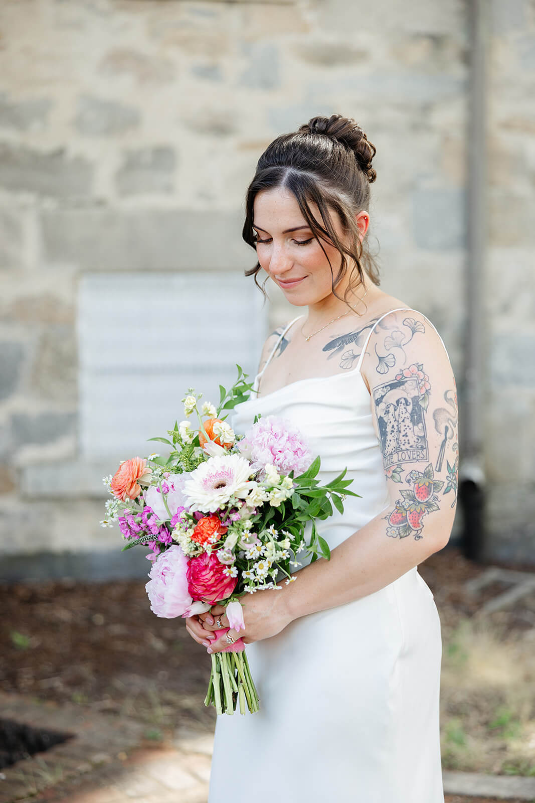 Laura Lee's Spring Wedding Photography 7 portrait of bride in her dress looking down as she holds her bouquet