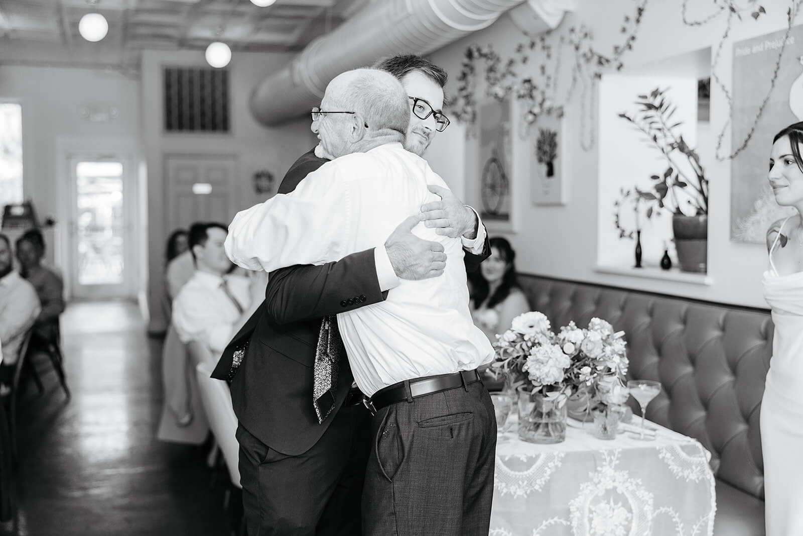 Laura Lee's Spring Wedding Photography 17 black and white photo of groom hugging a family member