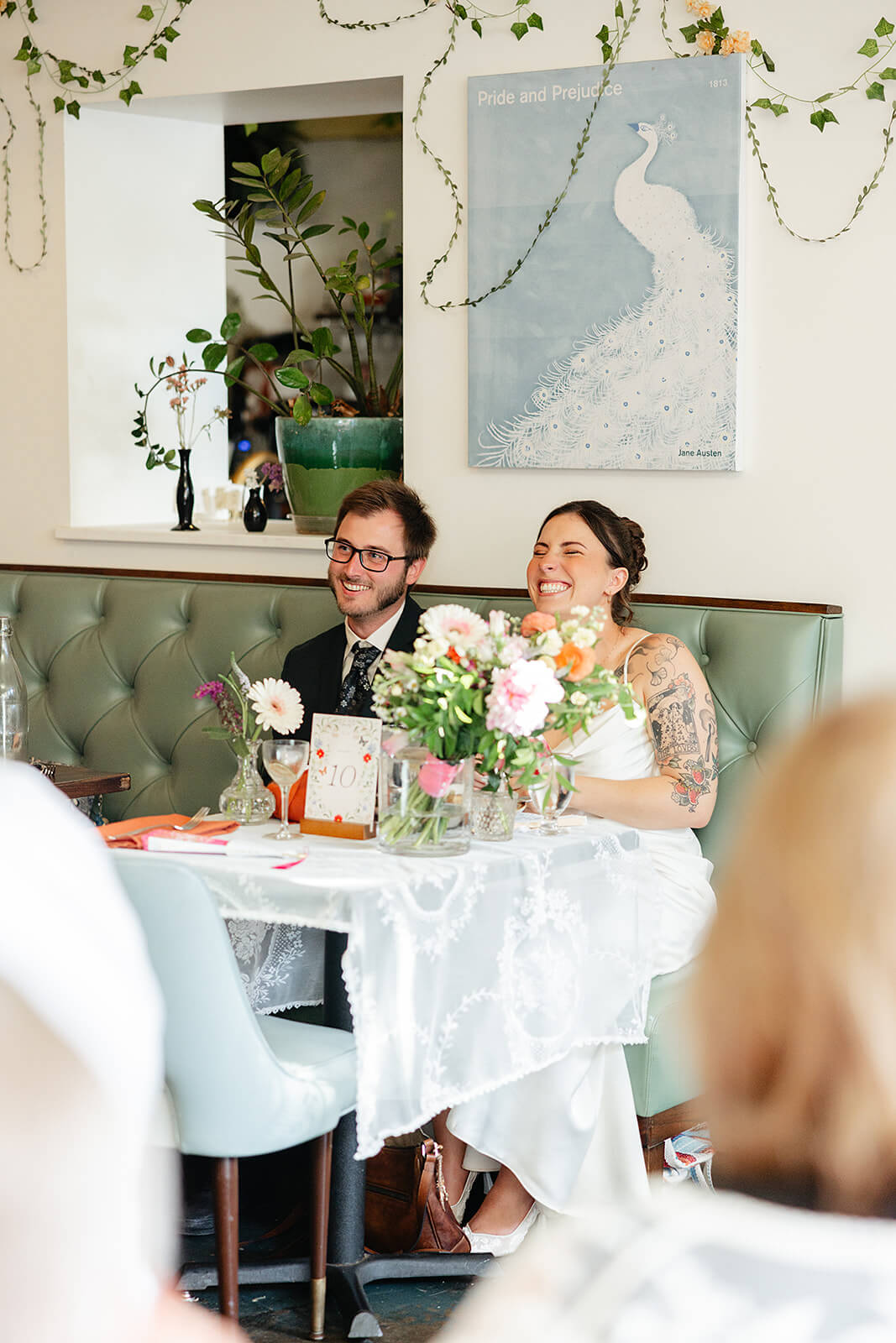 Laura Lee's Spring Wedding Photography 19 bride laughing as she listens to speech
