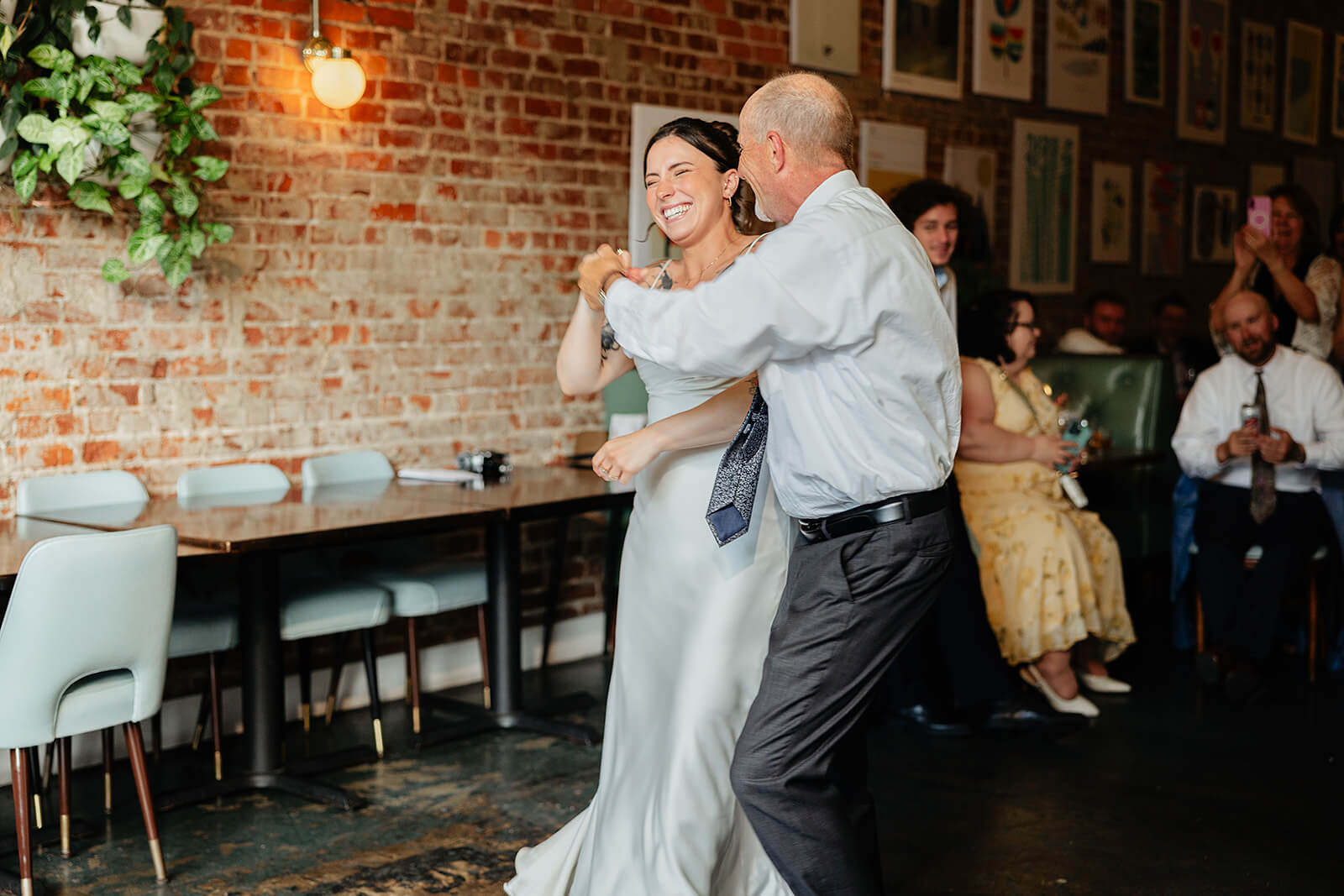 Laura Lee's Spring Wedding Photography 22 bride laughing as she dances with her dad
