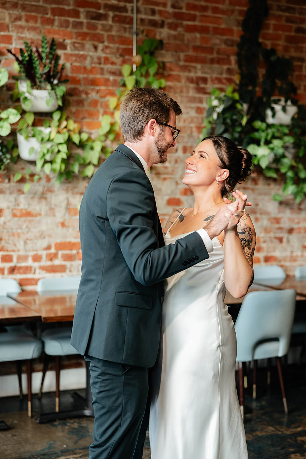 Laura Lee's Spring Wedding Photography 24 bride giving a huge smile to the groom as they dance together