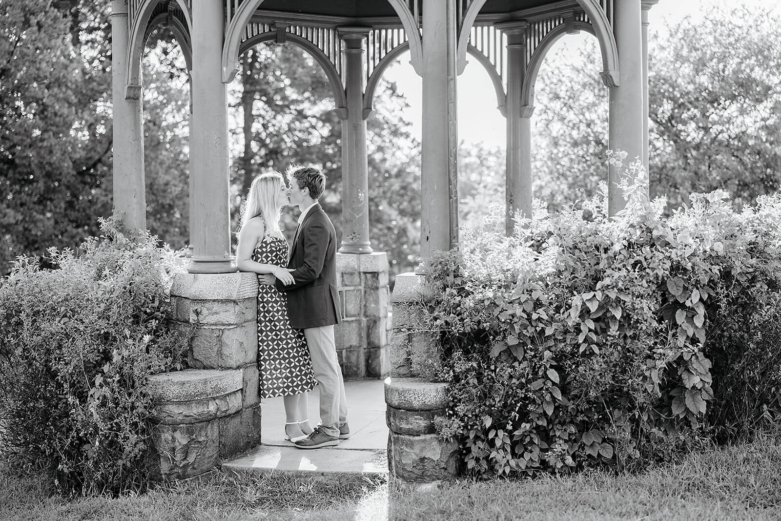 Maymont Summer Engagement Photography 12 black and white photo of couple kissing in a gazebo