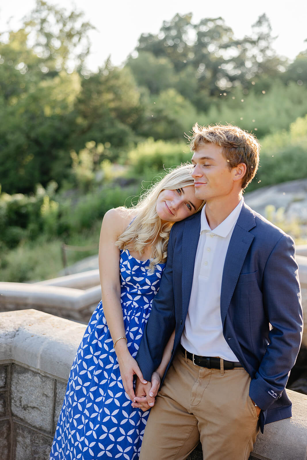 Maymont Summer Engagement Photography 19 couple holding hands and leaning on each other on a stone balcony
