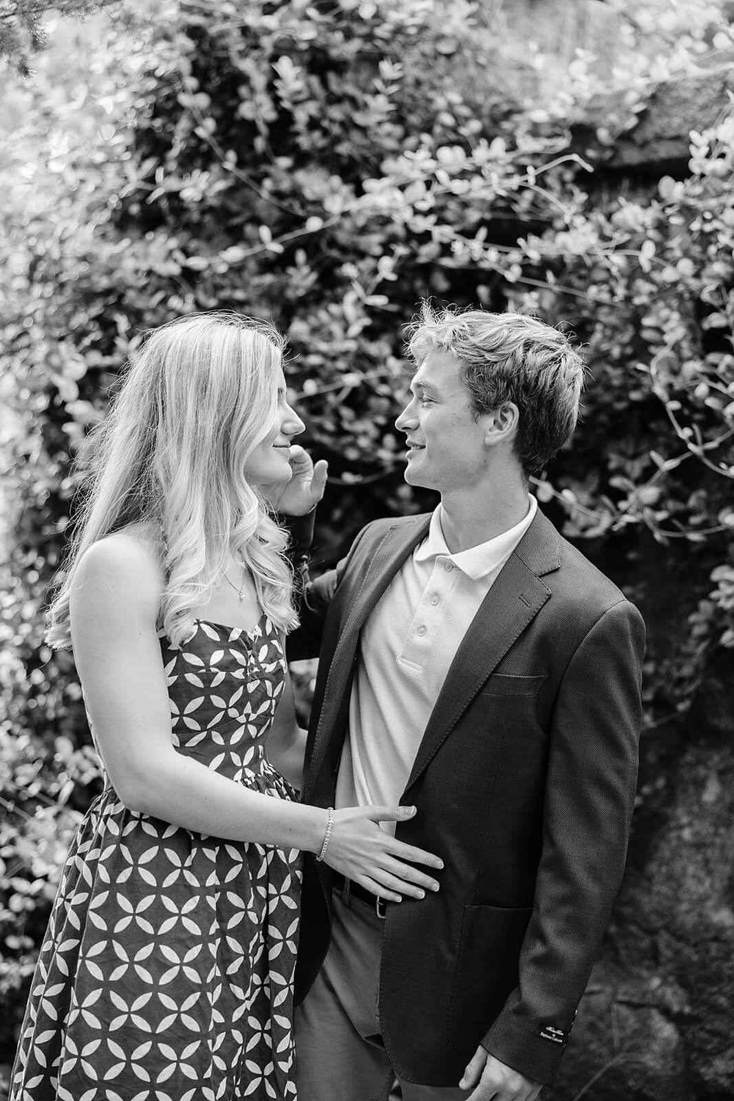 Maymont Summer Engagement Photography 2 black and white photo of couple smiling at each other while man strokes girl's cheek