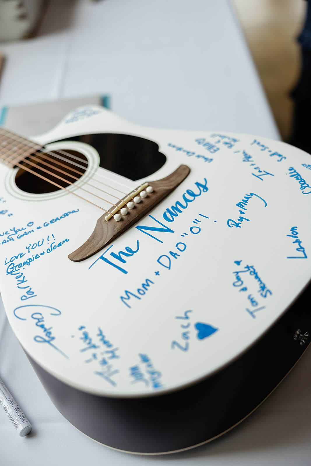 Rassawek Vineyard Spring Wedding Photography 20 white guitar with blue signatures from all the guests