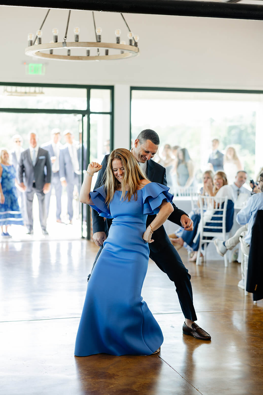 Rassawek Vineyard Spring Wedding Photography 32 couple dancing together on the dance floor while all the guests sit and watch