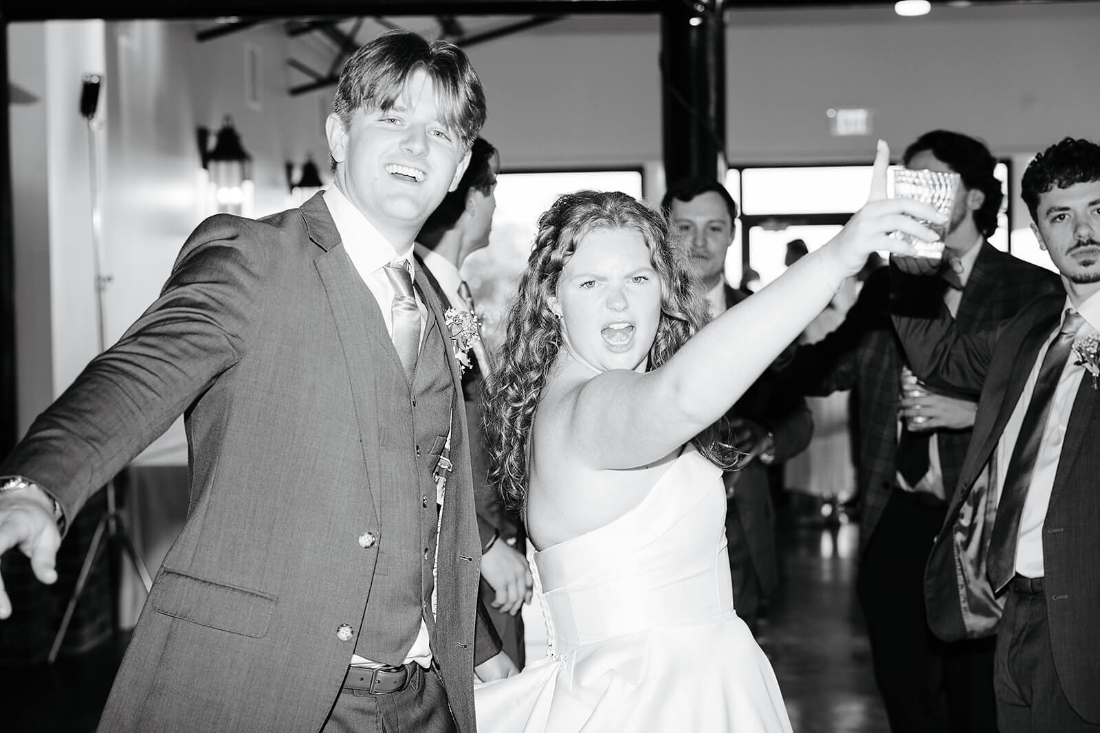 Rassawek Vineyard Spring Wedding Photography 41 black and white photo of bride and groom dancing with lots of guests