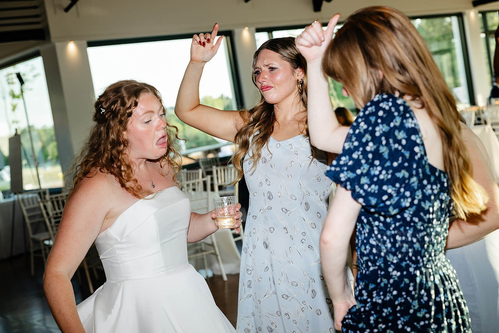 Rassawek Vineyard Spring Wedding Photography 42 bride dancing with guests on the dance floor
