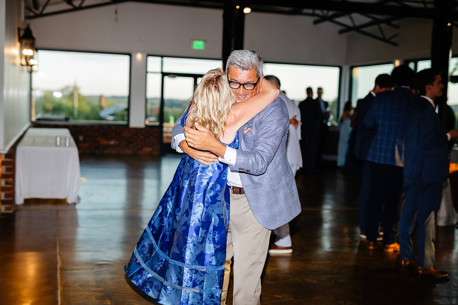 Rassawek Vineyard Spring Wedding Photography 44 guests hugging each other and dancing