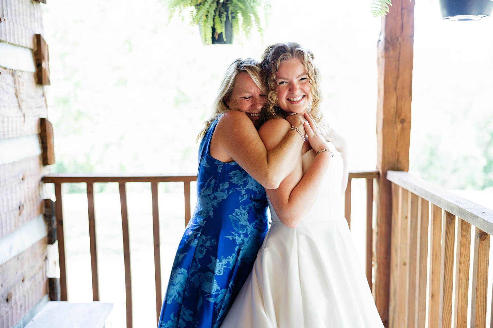 Rassawek Vineyard Spring Wedding Photography 6 bride's mom hugging bride from behind
